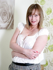 Horny British housewife playing in bed